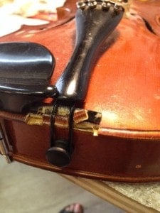 Broken violin saddle