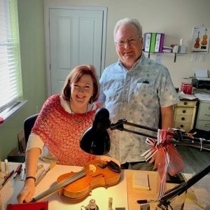 https://www.kellerstrings.com/wp-content/uploads/2022/06/John-Paula-at-work-bench.jpg